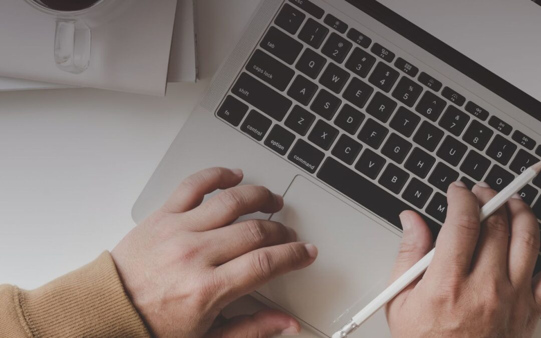 Digital nomad working remotely on a laptop while traveling, managing mail online